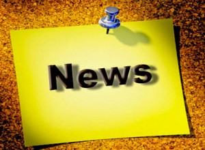 Yellow reminder with pin on notice board