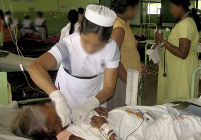 A nurse treats a victim at a hospital in Moneragala