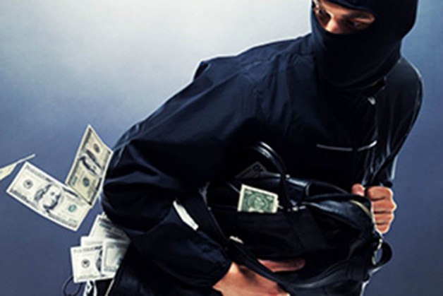 young-male-thief-stealing-money-from-bank-ss-61648672-300x2001