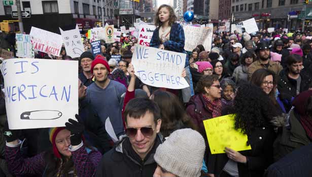 201701221048136951_Women-across-the-world-hit-the-streets-against-Trump_SECVPF
