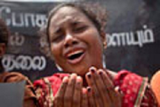 A family member of an ethnic Tamil detainee cries during a silent protest in Colombo, Sri Lanka, Wednesday, Oct. 14, 2015. Relatives and civil rights activists are demanding the Sri Lankan government to release hundreds of minority ethnic Tamils detained without charges for years on suspicion of links to the now-defeated Tamil Tiger rebels. (AP Photo/Eranga Jayawardena)
