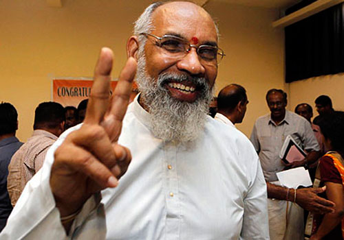 Chief Minister-elect for Sri Lanka’s northern provincial government, retired Supreme Court Justice C.V. Wigneswaran flashes a victory sign following a media briefing in Jaffna, Sri Lanka, Sunday, Sept. 22, 2013. The Tamil National Alliance, a former political proxy for Sri Lanka's defeated Tamil Tiger rebels swept the country's northern provincial election, according to results released Sunday, in what is seen as a resounding call for wider regional autonomy in areas ravaged by a quarter century of civil war. (AP Photo/Eranga Jayawardena)